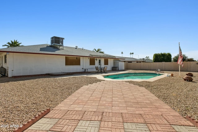 view of pool featuring a patio and central AC