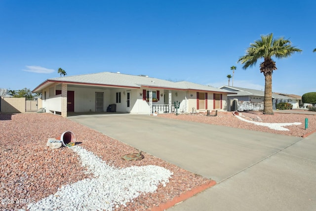 ranch-style house featuring a carport