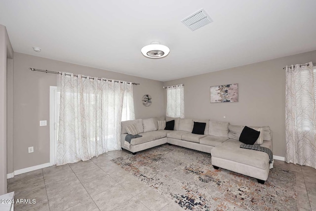 living room with light tile patterned flooring