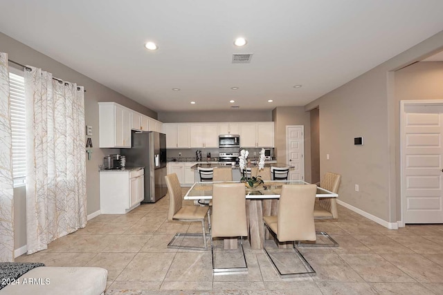 dining area featuring a healthy amount of sunlight