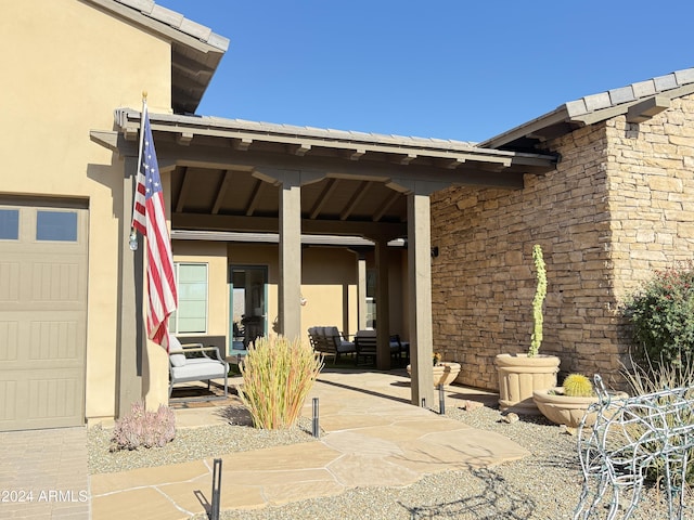 view of patio / terrace featuring a garage