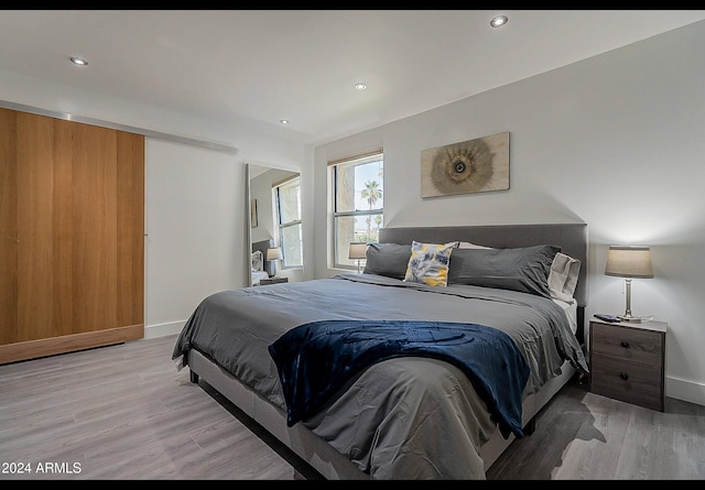 bedroom with light wood-type flooring