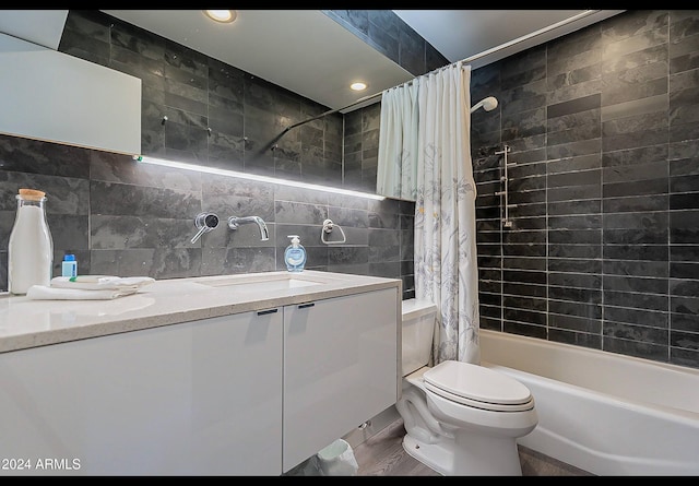 full bathroom featuring tile walls, toilet, shower / bath combo, and hardwood / wood-style flooring