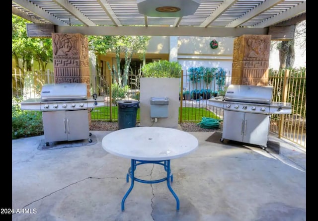 view of patio / terrace with a pergola and area for grilling