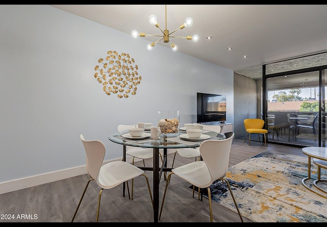 dining room featuring hardwood / wood-style floors and a notable chandelier