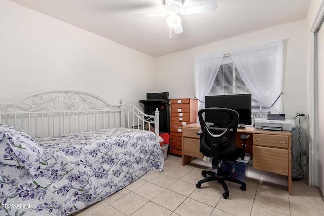 bedroom with light tile patterned floors and ceiling fan