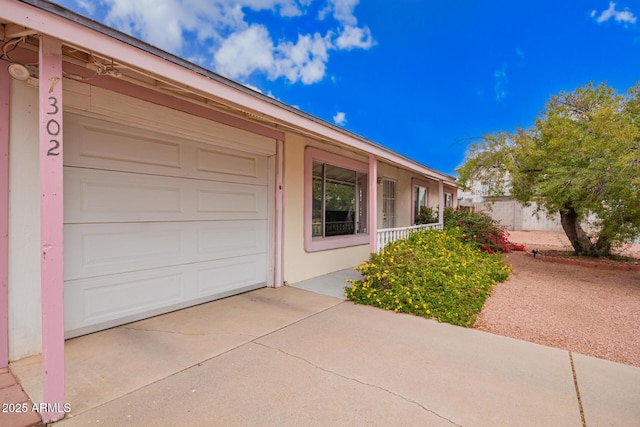 exterior space with concrete driveway