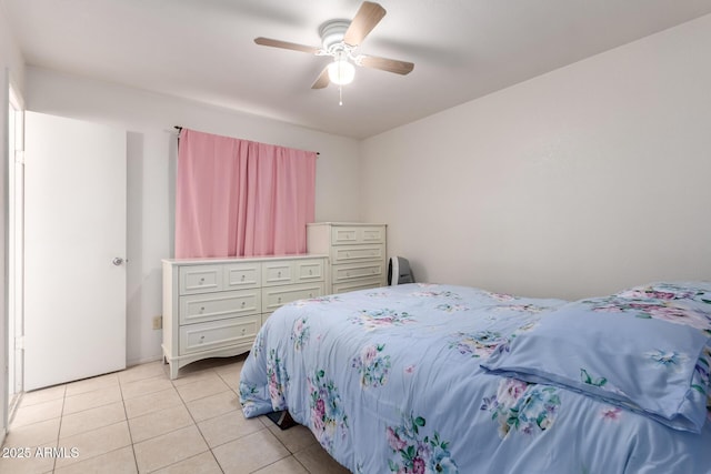 bedroom with light tile patterned floors and ceiling fan