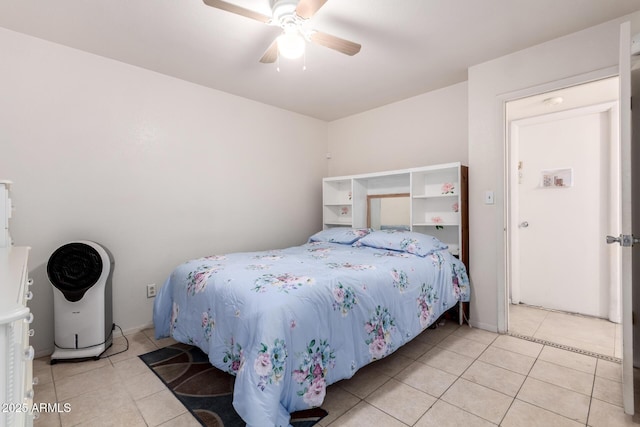 tiled bedroom featuring a ceiling fan