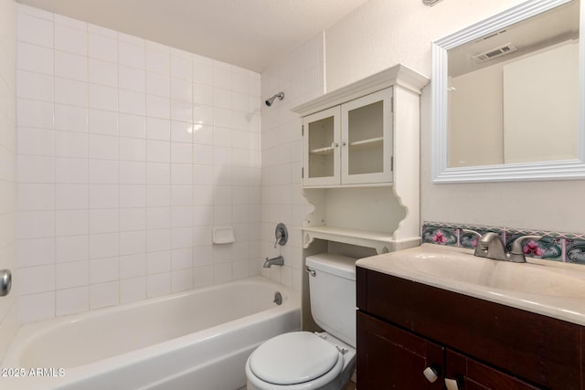 full bath featuring vanity, toilet, visible vents, and shower / bath combination