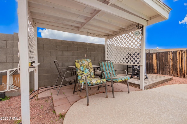 view of patio / terrace featuring fence