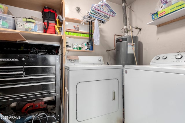 laundry area featuring laundry area, washing machine and dryer, and electric water heater