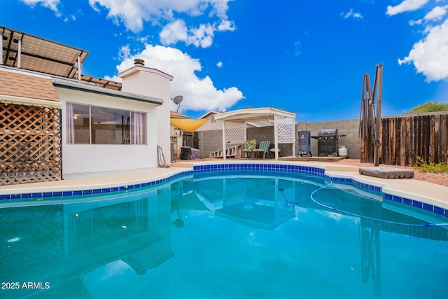 view of swimming pool featuring a fenced in pool and fence