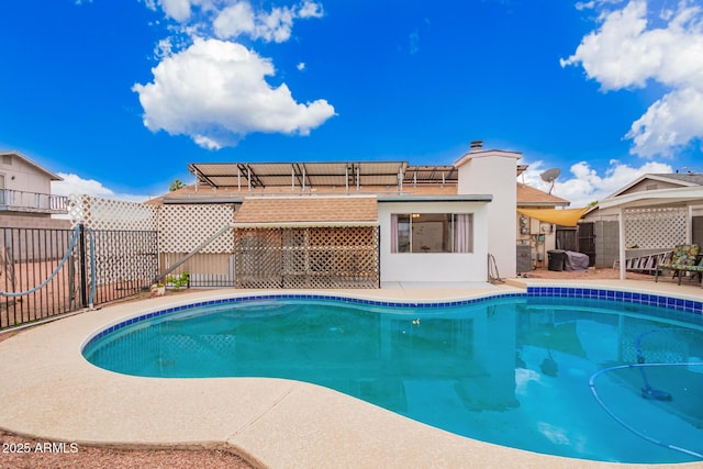 view of pool with a patio area, a fenced in pool, and fence