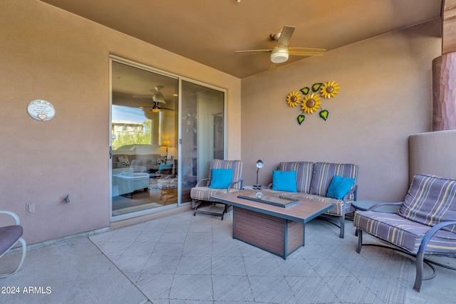 view of patio with an outdoor living space and ceiling fan