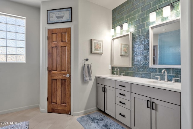 bathroom with tasteful backsplash, dual vanity, and tile flooring