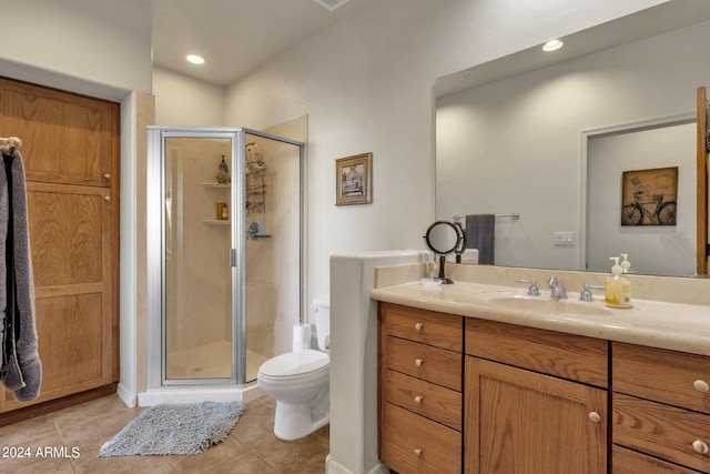 bathroom with a shower with door, toilet, tile flooring, and vanity