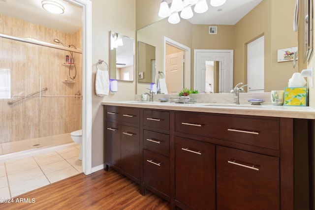 9550 E Thunderbird Rd Unit 152, Scottsdale, AZ 85260 - full bath with double vanity, a stall shower, and wood finished floors