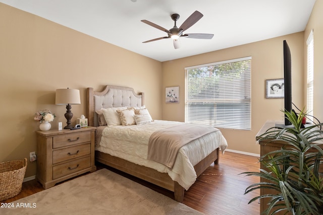 9550 E Thunderbird Rd Unit 152, Scottsdale, AZ 85260 - bedroom featuring light wood-style flooring and a ceiling fan