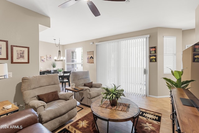 9550 E Thunderbird Rd Unit 152, Scottsdale, AZ 85260 - living room featuring a ceiling fan, light wood-style floors, and a chandelier