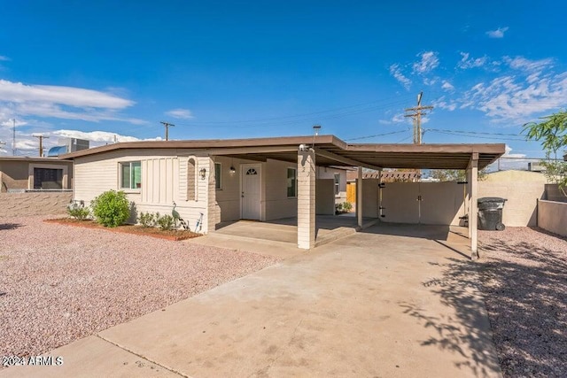 view of front facade with a carport