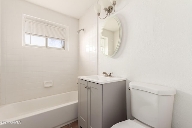 full bathroom with vanity, toilet, and tiled shower / bath