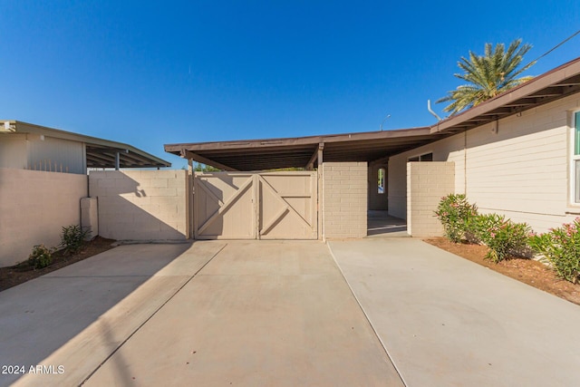 exterior space featuring a carport