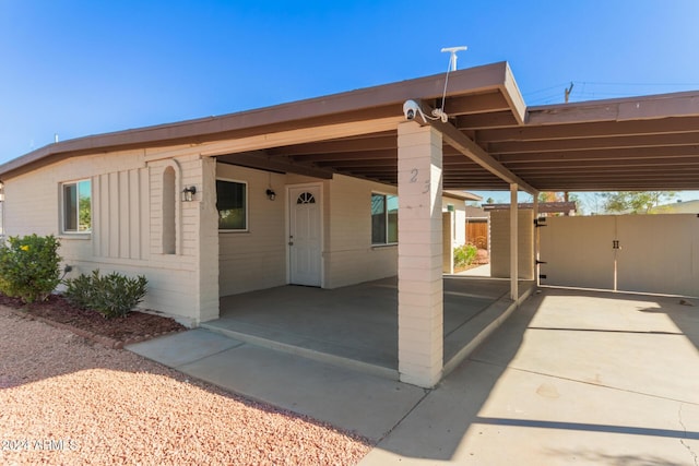 view of front of home with a carport