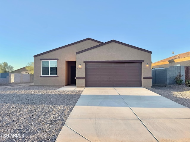 ranch-style home featuring a garage