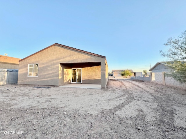 rear view of house featuring a patio