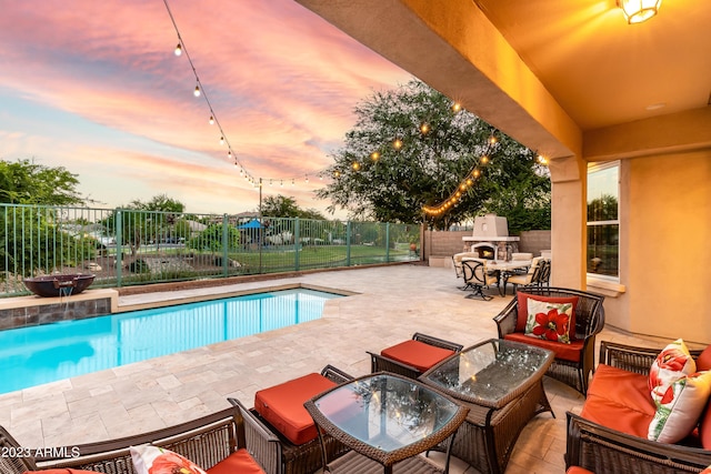 921 E Canyon Way, Chandler, AZ 85249 - view of pool with a patio, an outdoor living space with a fireplace, and a fenced backyard