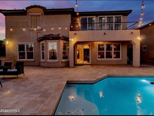921 E Canyon Way, Chandler, AZ 85249 - rear view of property with a balcony, a patio area, stucco siding, and an outdoor pool