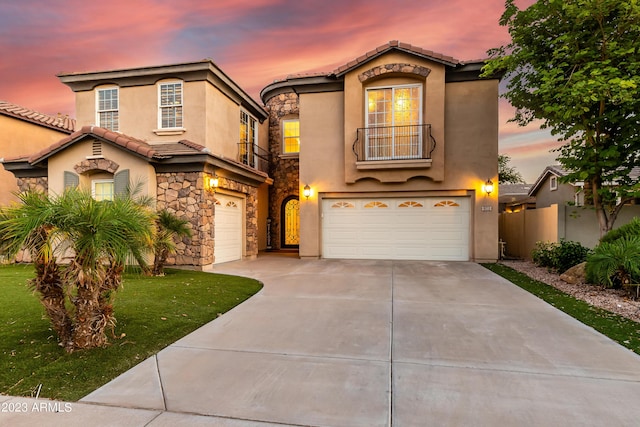 921 E Canyon Way, Chandler, AZ 85249 - mediterranean / spanish house with an attached garage, stone siding, stucco siding, concrete driveway, and a tiled roof