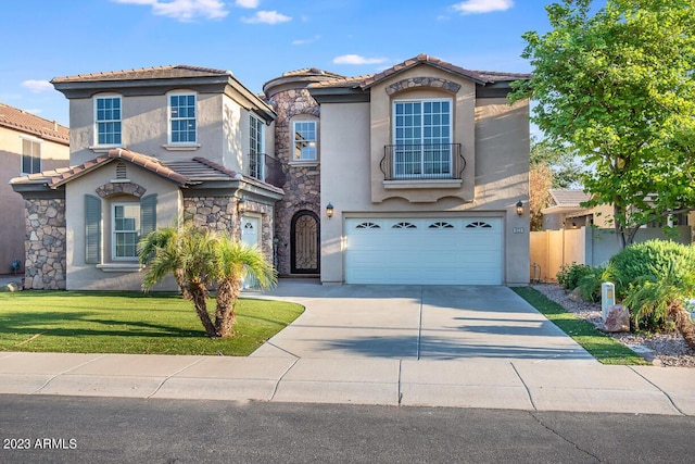 921 E Canyon Way, Chandler, AZ 85249 - mediterranean / spanish-style house featuring stucco siding, concrete driveway, a tile roof, and a garage