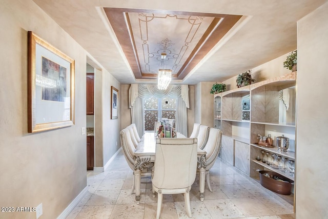 921 E Canyon Way, Chandler, AZ 85249 - dining room featuring a raised ceiling, baseboards, and a chandelier