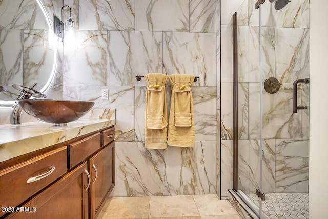 921 E Canyon Way, Chandler, AZ 85249 - full bathroom featuring a marble finish shower, vanity, and tile walls