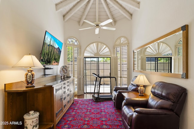7955 E Chaparral Rd Unit 129, Scottsdale, AZ 85250 - sitting room with high vaulted ceiling, plenty of natural light, ceiling fan, dark wood finished floors, and a wooden ceiling with exposed beams