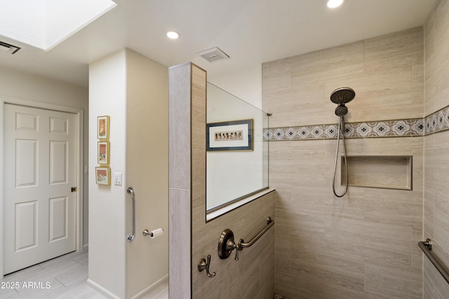 7955 E Chaparral Rd Unit 129, Scottsdale, AZ 85250 - bathroom featuring tiled shower, a skylight, and recessed lighting