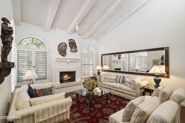 7955 E Chaparral Rd Unit 129, Scottsdale, AZ 85250 - living area featuring a tiled fireplace and healthy amount of natural light