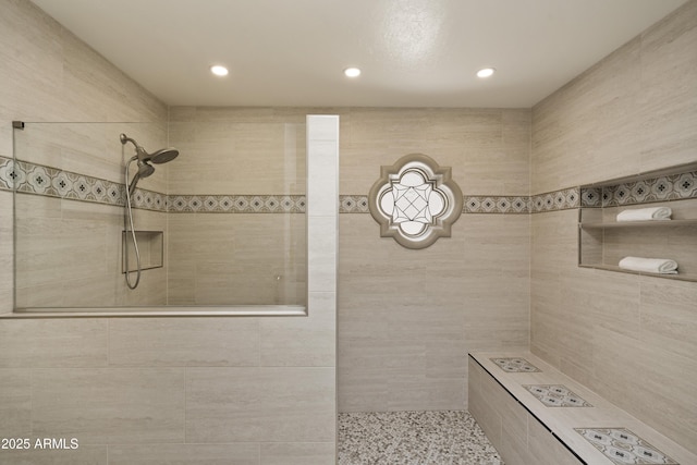 7955 E Chaparral Rd Unit 129, Scottsdale, AZ 85250 - full bathroom featuring tiled shower, recessed lighting, and tile walls