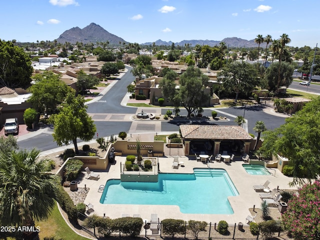 7955 E Chaparral Rd Unit 129, Scottsdale, AZ 85250 - community pool with a patio area, a mountain view, and a residential view
