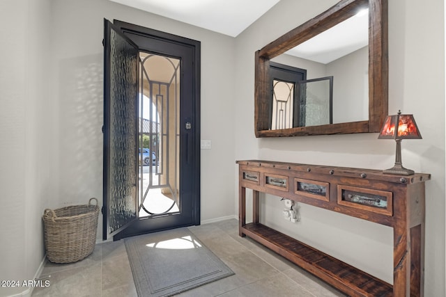 foyer entrance with light tile patterned floors