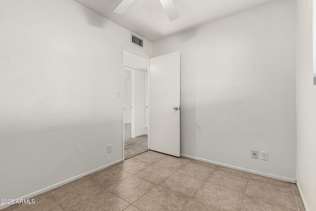 3208 W Port Royale Ln, Phoenix, AZ 85053 - empty room with a ceiling fan and light tile patterned flooring