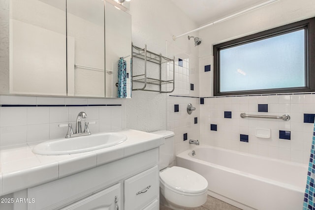 3208 W Port Royale Ln, Phoenix, AZ 85053 - bathroom featuring decorative backsplash, vanity, a textured wall, and shower / tub combo