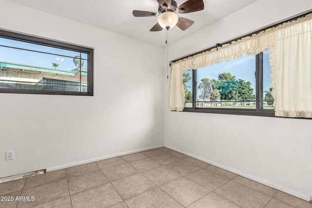 3208 W Port Royale Ln, Phoenix, AZ 85053 - spare room with a ceiling fan and light tile patterned floors