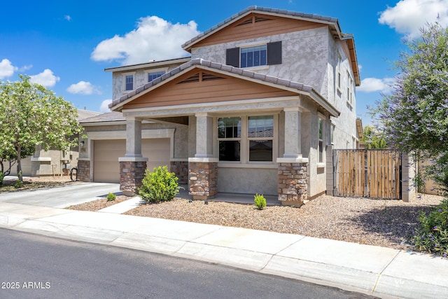 2741 S Gordon, Mesa, AZ 85209 - craftsman-style home with stone siding, a garage, concrete driveway, fence, and stucco siding
