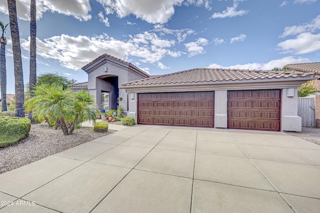 mediterranean / spanish-style home featuring a garage