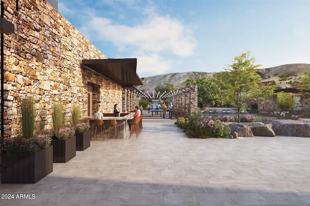 view of patio / terrace with a mountain view