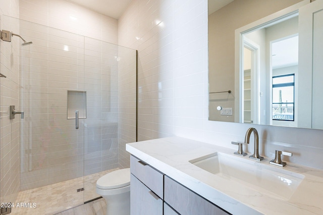 bathroom featuring vanity, wood-type flooring, a shower with door, and toilet