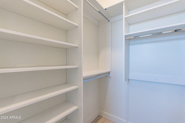 walk in closet featuring wood-type flooring